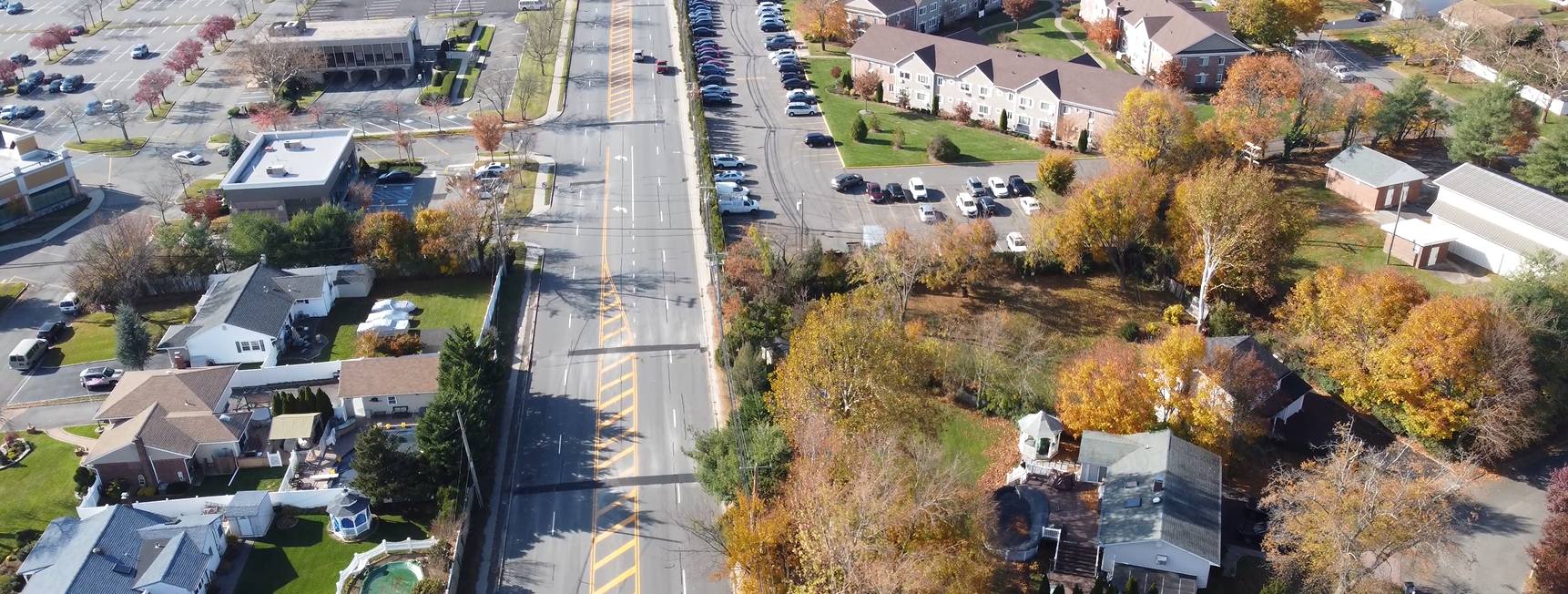 An aerial view of suburban homes and buildings. 